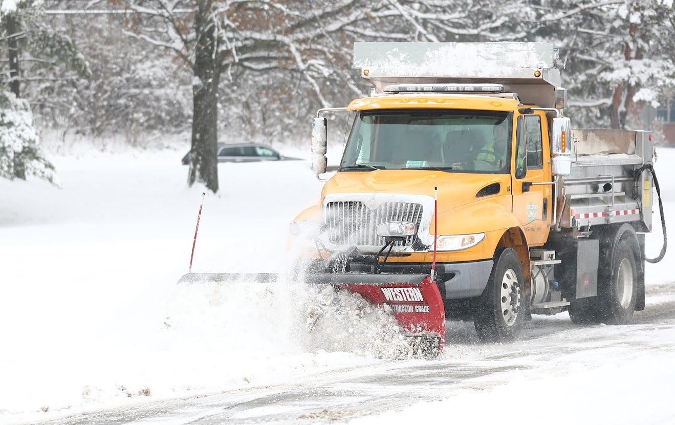 Amberley Village snow plow clears roads during a heavy snowfall